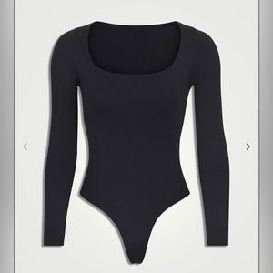 Skims black scoop neck bodysuit. More photos available upon request.